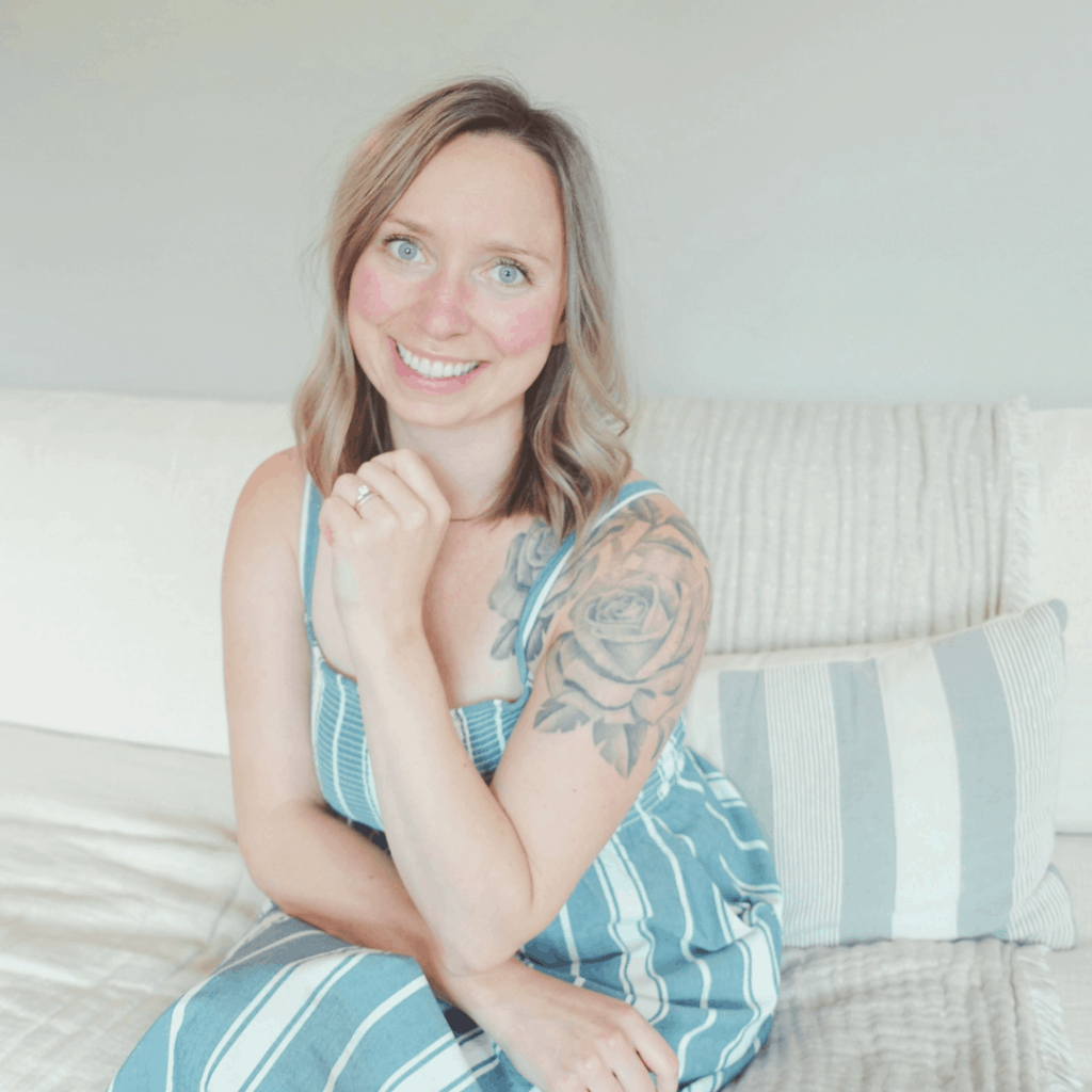 Healthfully rooted home author woman with rose tattoo and blue striped sundress
