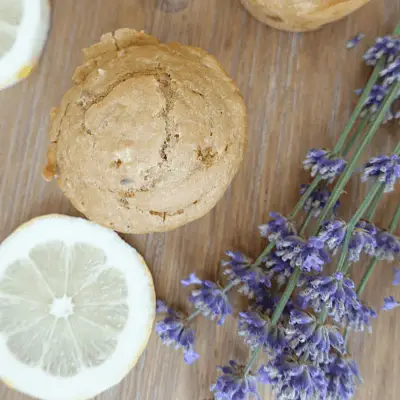lemon and lavender sourdough discard muffin with lemon slices and lavender flowers