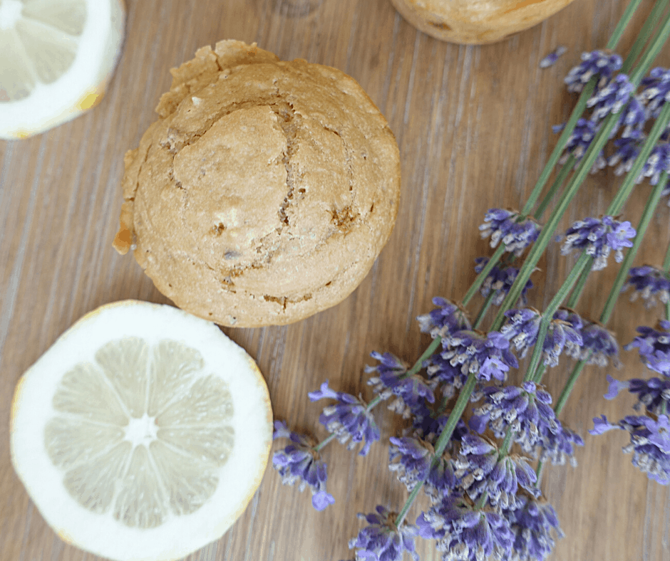 lemon and lavender sourdough discard muffin with lemon slices and lavender flowers