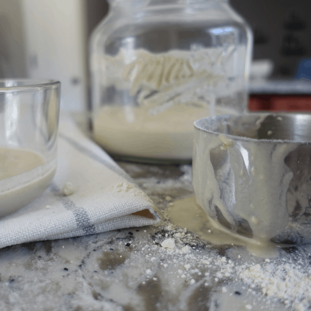 process of making natural yeast with measuring cup flour and discard
