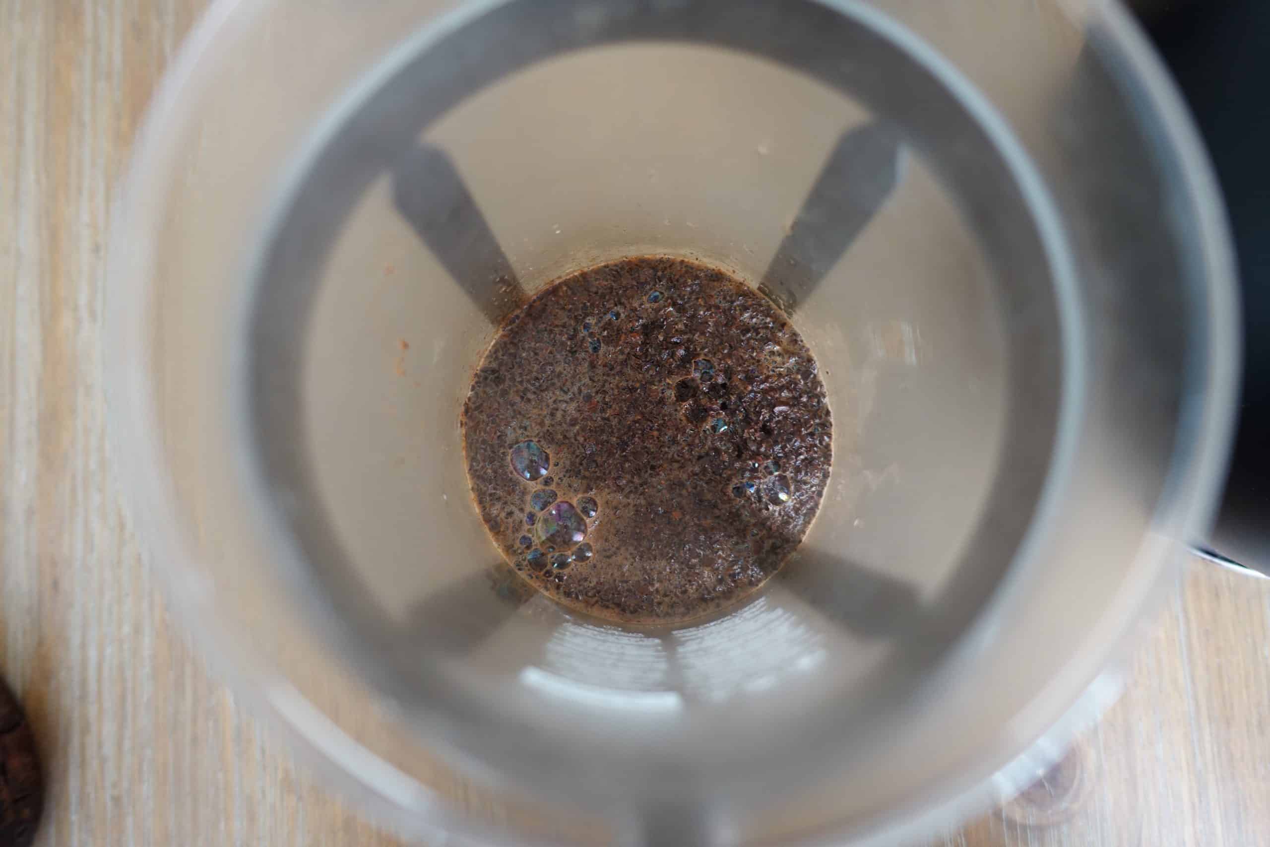 french press coffee showing a bloom after initial pour