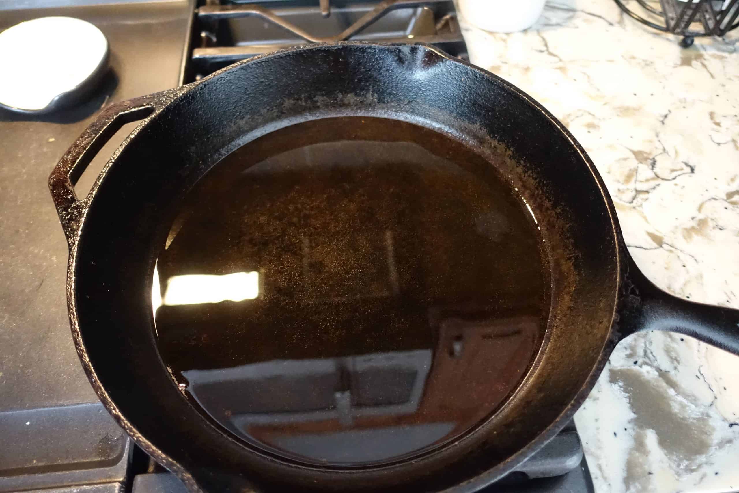 preheating oil in a well seasoned cast iron skillet