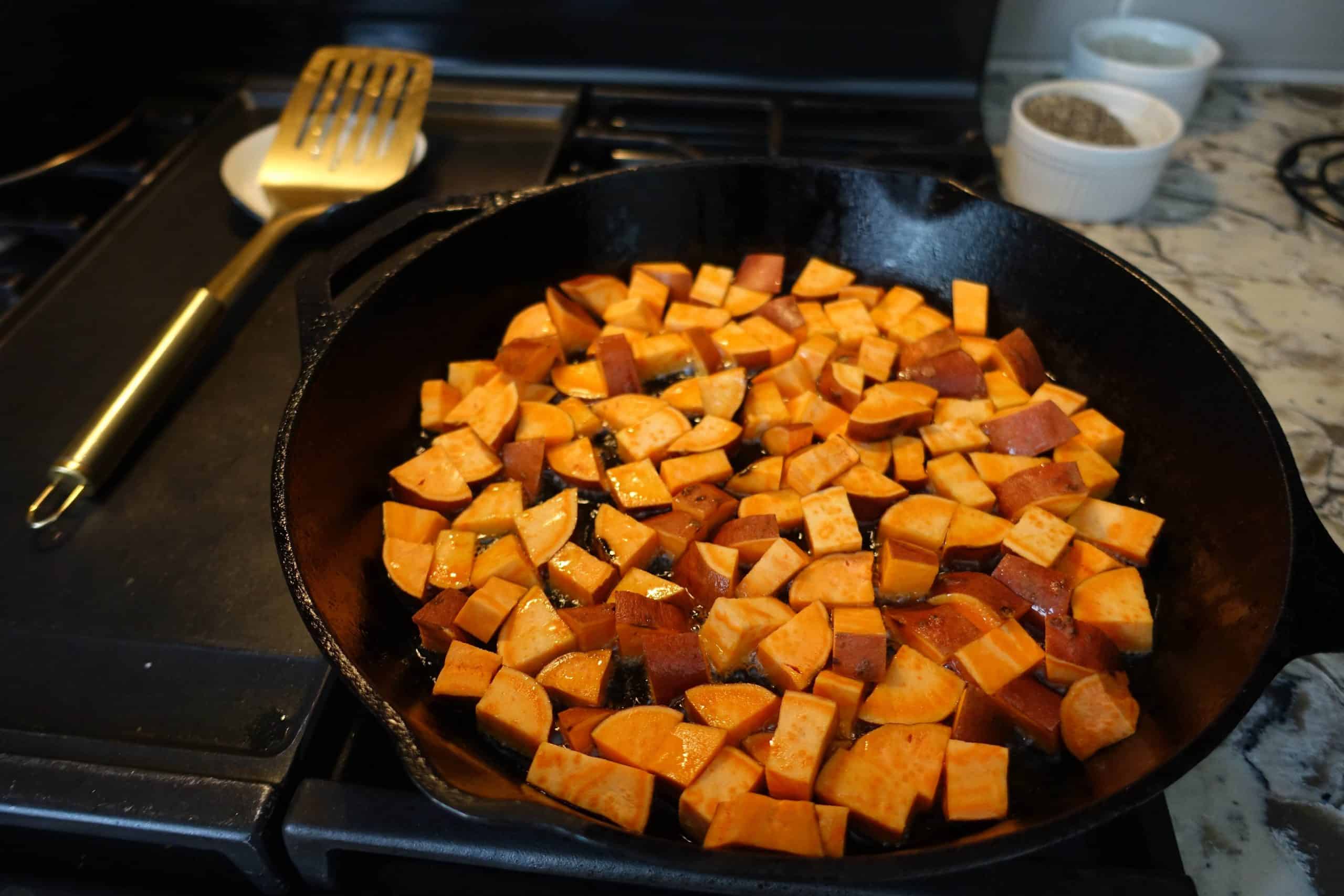 sauteeing sweet potatoes in a single layer on cast iron skillet