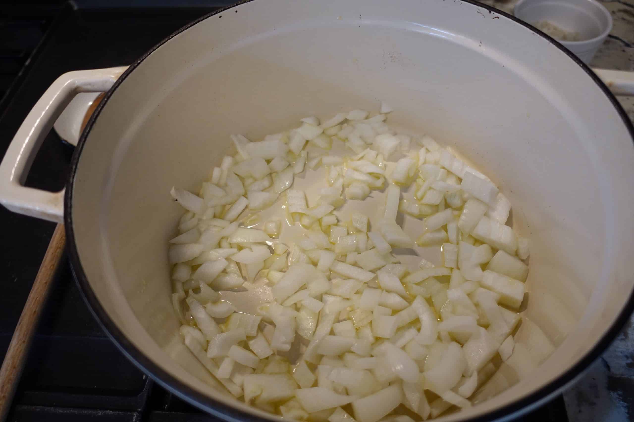 healthfully rooted home heart healthy chili diced onions in white dutch oven