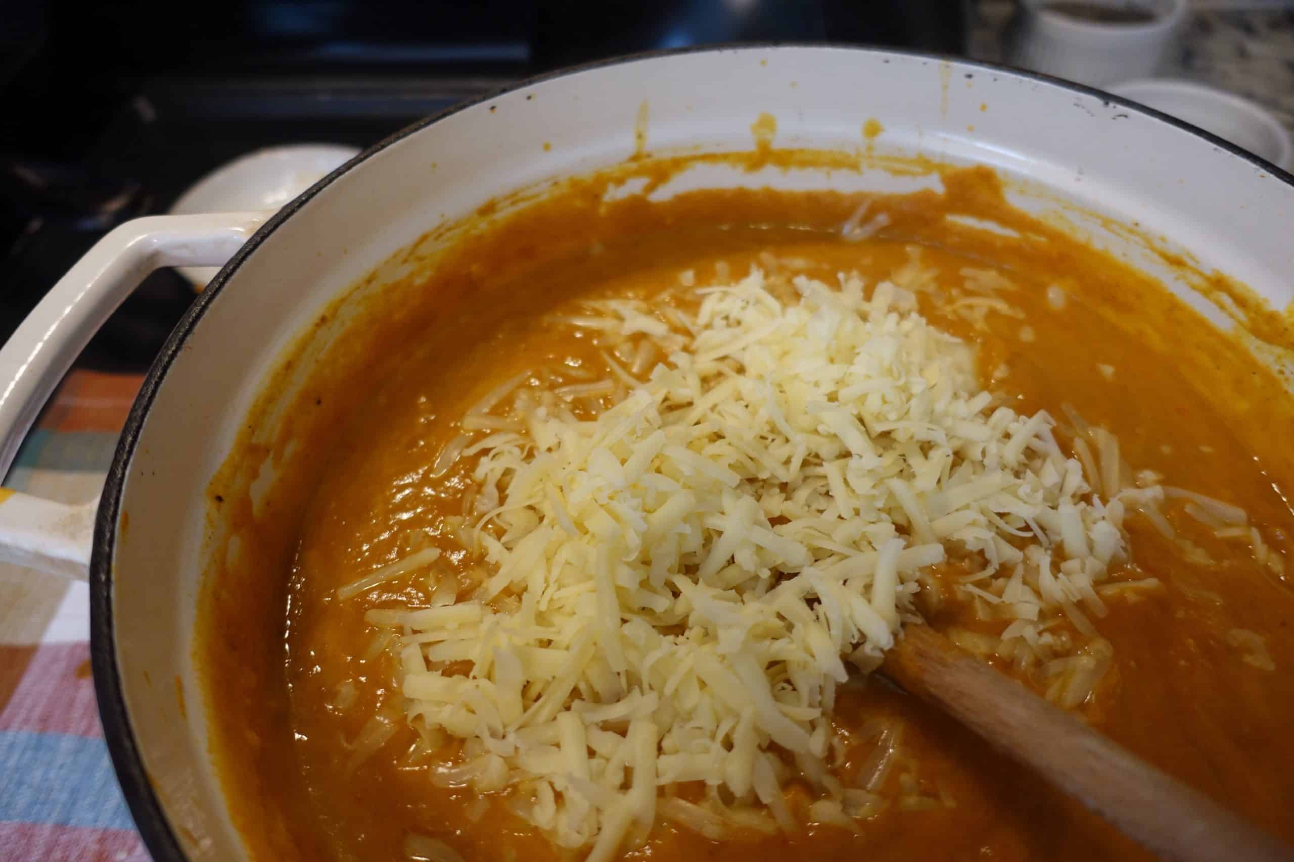 raw cheese and cream mixed in with spiced pumpkin chili