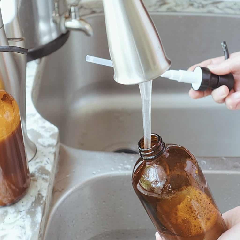 healthfully rooted home nontoxic living washing an amber jar