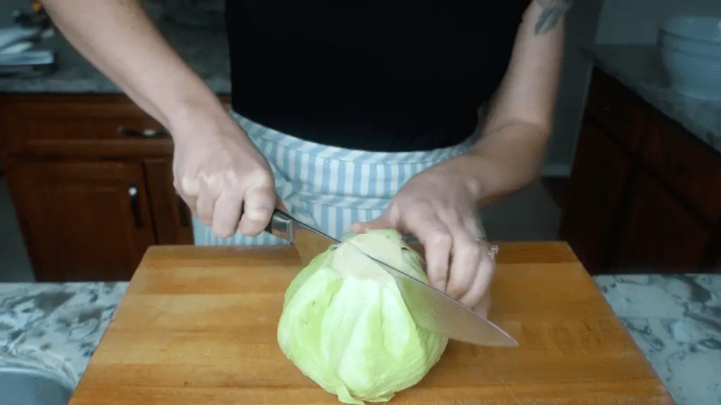 slicing the organic cabbage head in half