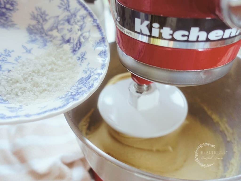 adding salt to dough inside of a stand mixer