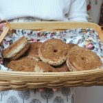 sourdough donuts with cinnamon sugar in a longaberger basket with floral liner