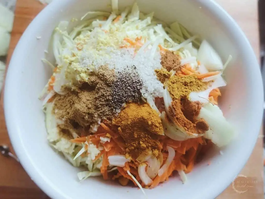 all the spices and ingredients in a bowl for curry kraut