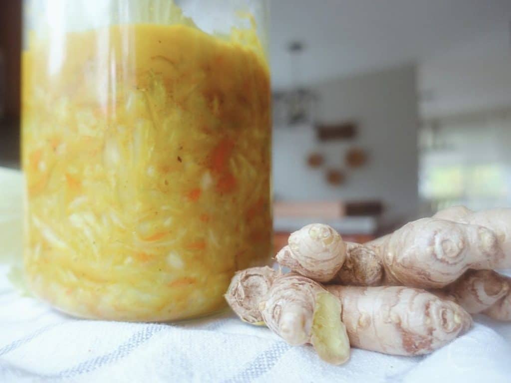 curry kraut with a ginger root next to it on a tea towel 