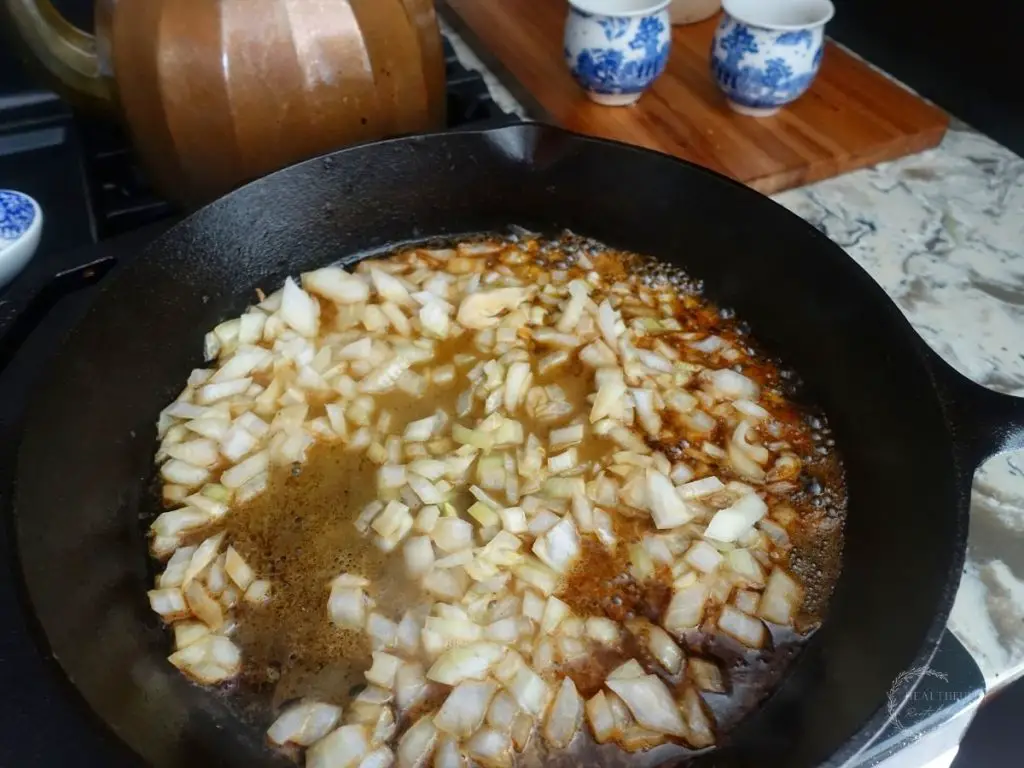 onion in a cast iron skillet with lemon juice