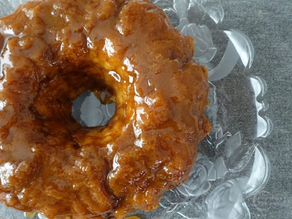 sourdough monkey bread flipped out onto a serving platter so you can see the salted caramel glaze
