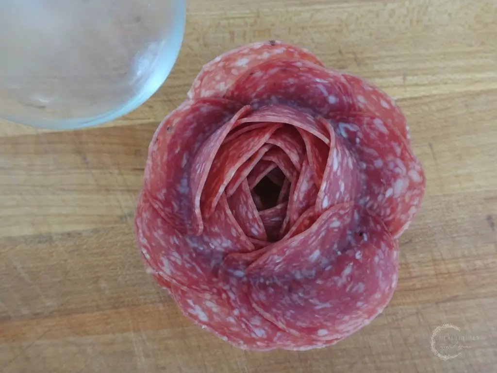 salami rose next to the wine glass that was used to make it