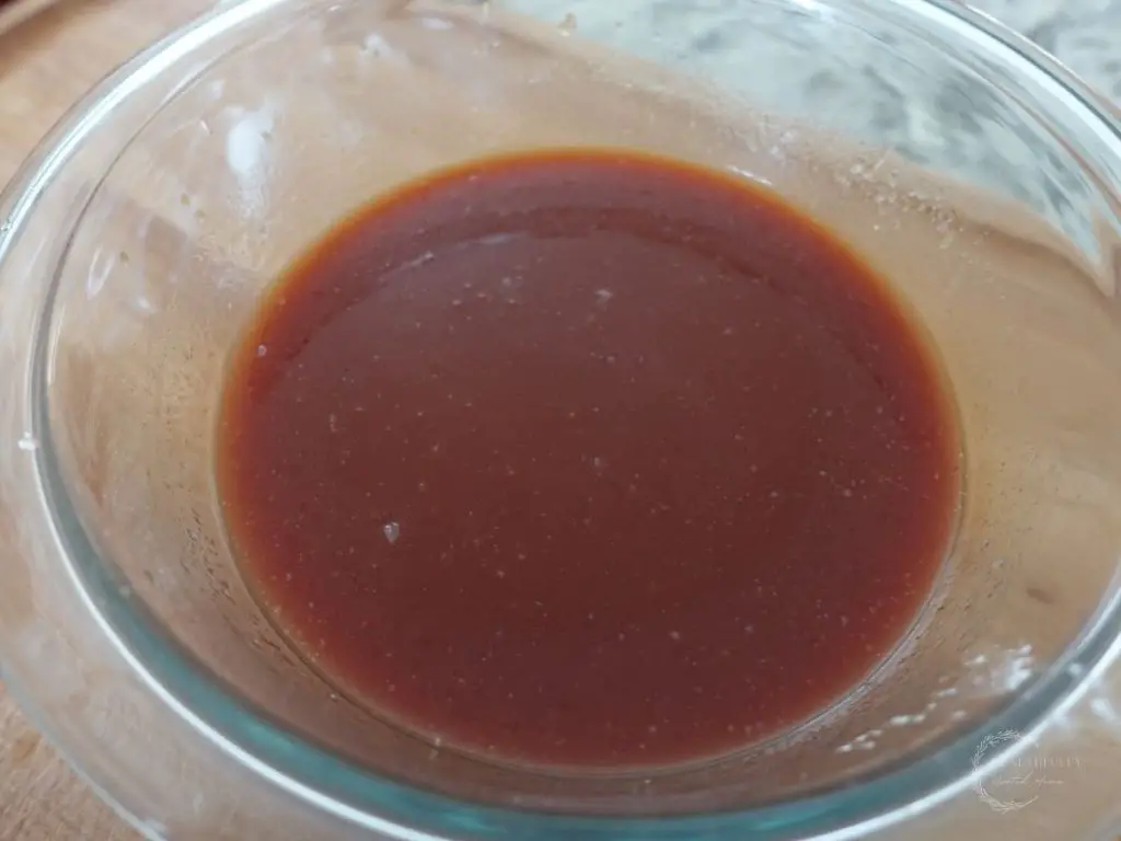 homemade healthy sweet and sour sauce in a glass bowl