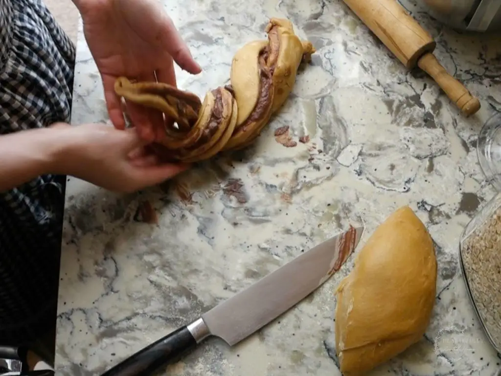 braiding the sourdough babka pieces together