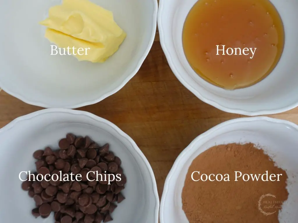 all the ingredients used to make babka chocolate filling in white bowls and labels saying what they are