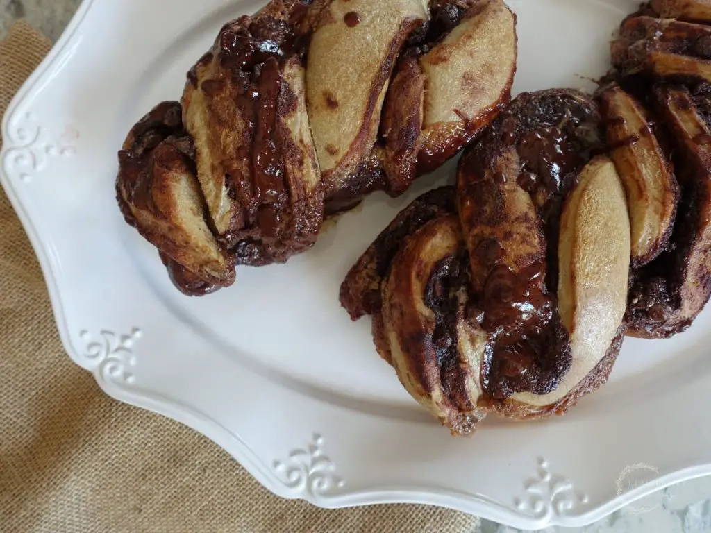 sourdough babka with chocolate filling on a white serving platter