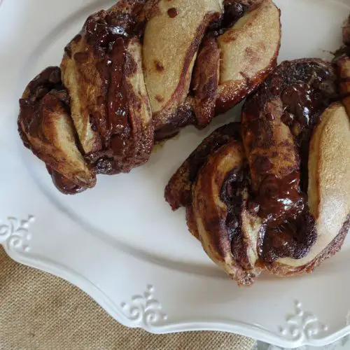 sourdough babka with chocolate filling on a white serving platter