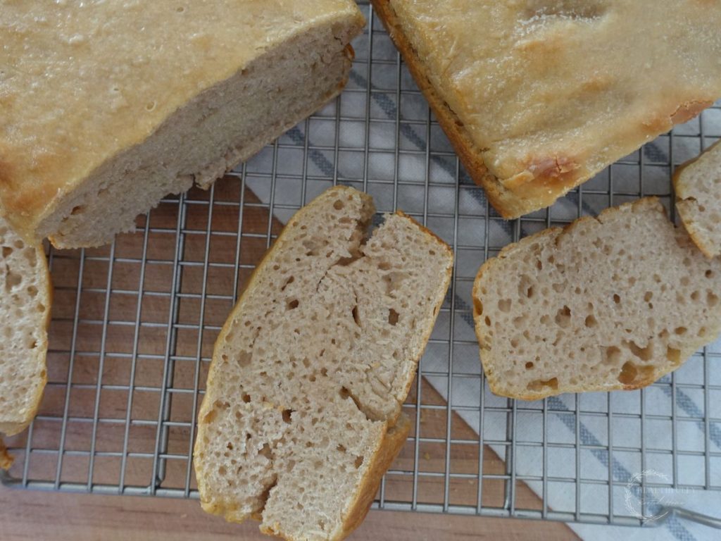 sourdough fermented sandwich bread with slices all around the loaves