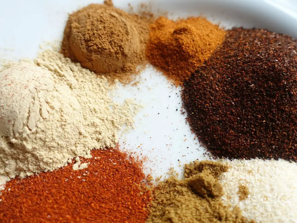 spices piled up on a white plate showing what to use to make diy low sodium taco seasoning