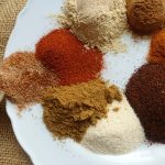 low sodium taco seasoning with all the spices to make the recipe on a white plate