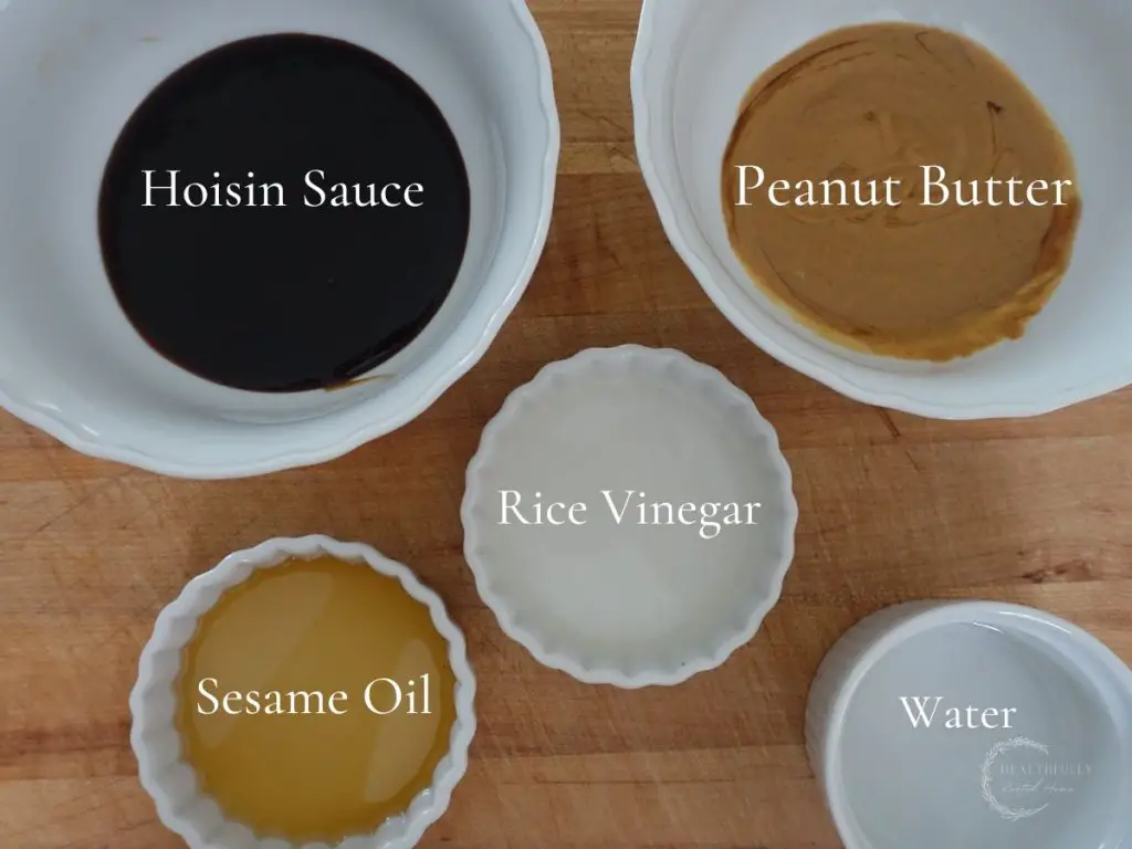 hoisin peanut sauce ingredients in white bowls with labels saying what they are