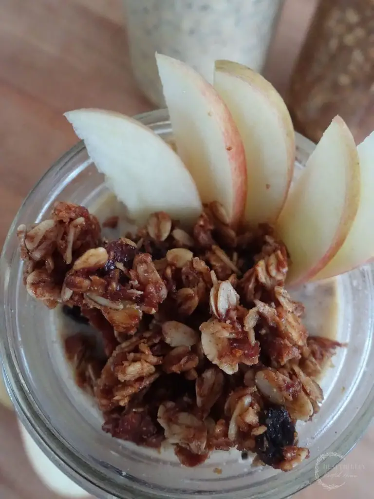 high protein overnight oats topped with granola and sliced apples