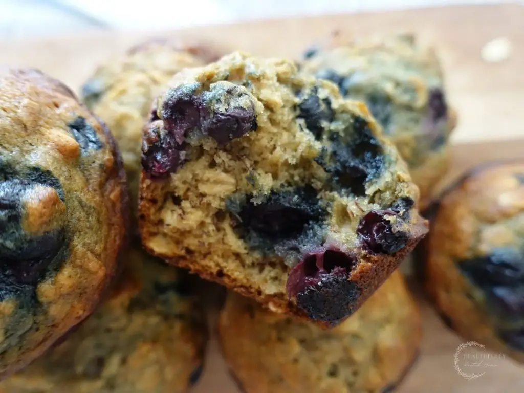 banana blueberry oatmeal muffin with a bite taken out