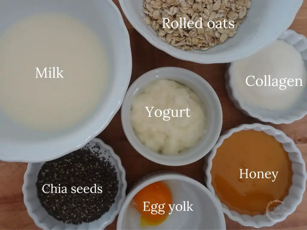 ingredients to make the high protein overnight oats recipe in white bowls with labels saying what they are