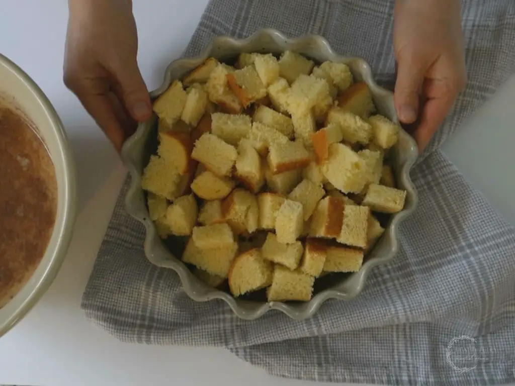brioche bread cut into cubes and placed in a baking dish for french toast casserole
